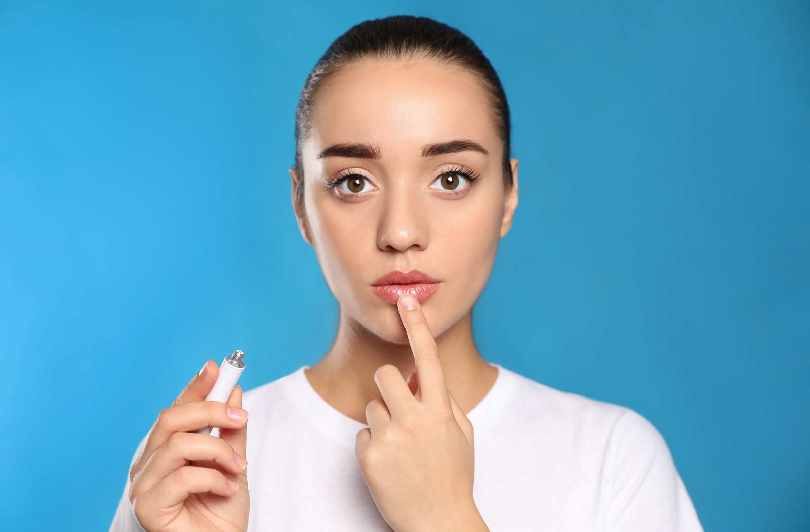 Woman touching her lip