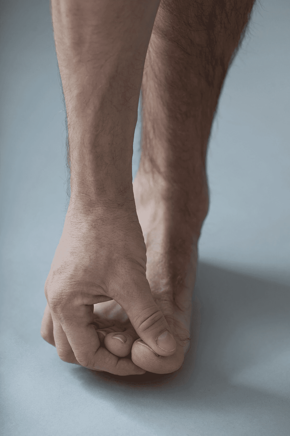 Hand holding toes